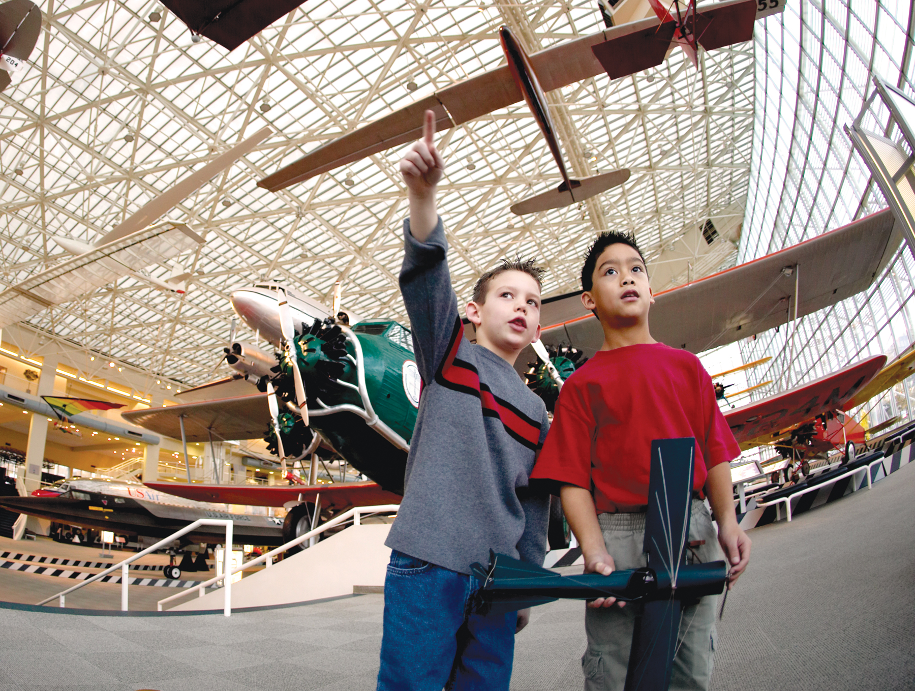 Young Boys Looking up at Planes in the Museum of Flight